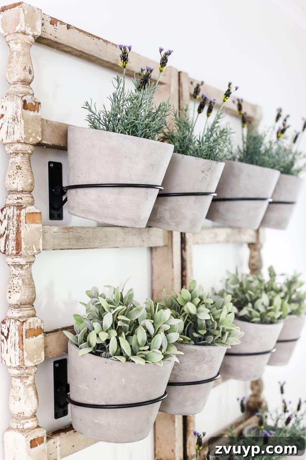 Heirloom Railing Wall Garden 8 DIY Antique Banister Wall Planter | www.blesserhouse.com - A quick and simple tutorial for how to make a wall planter from a repurposed antique banister using artificial plants. Cute way to bring the outdoors in!