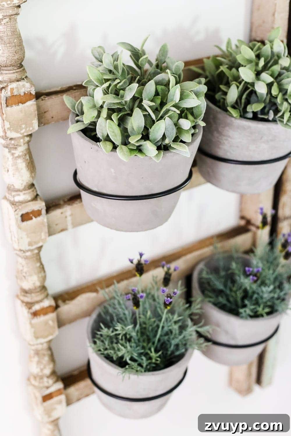 Heirloom Railing Wall Garden 9 DIY Antique Banister Wall Planter | www.blesserhouse.com - A quick and simple tutorial for how to make a wall planter from a repurposed antique banister using artificial plants. Cute way to bring the outdoors in!