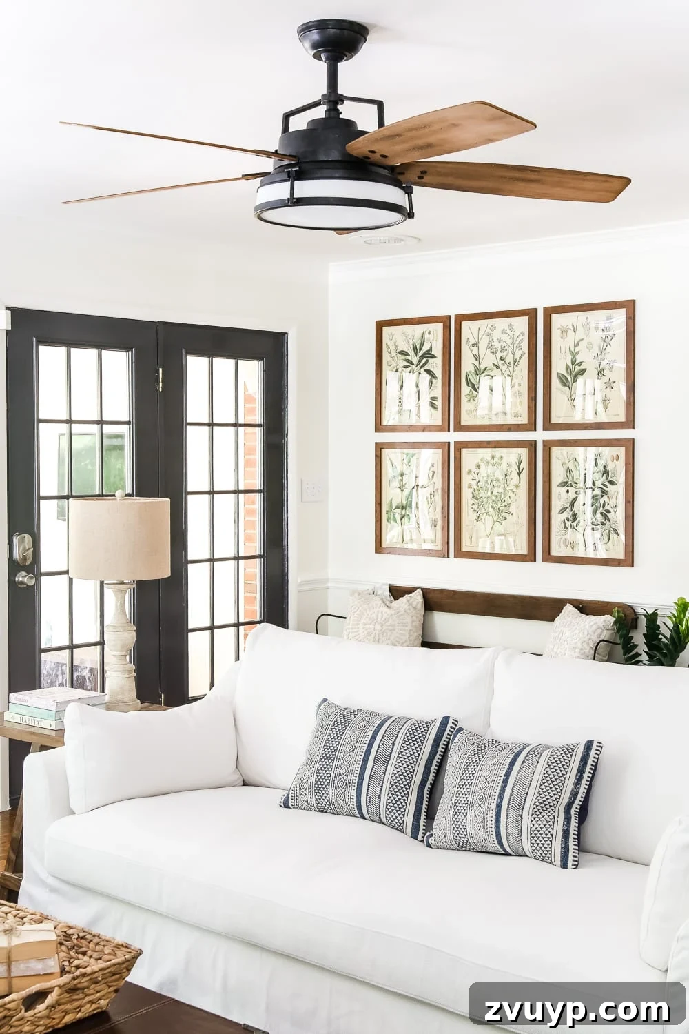 Explore a Modern French Farmhouse Summer Oasis 10 Modern French Farmhouse Summer Home Tour: Living Room with Blue Pillows