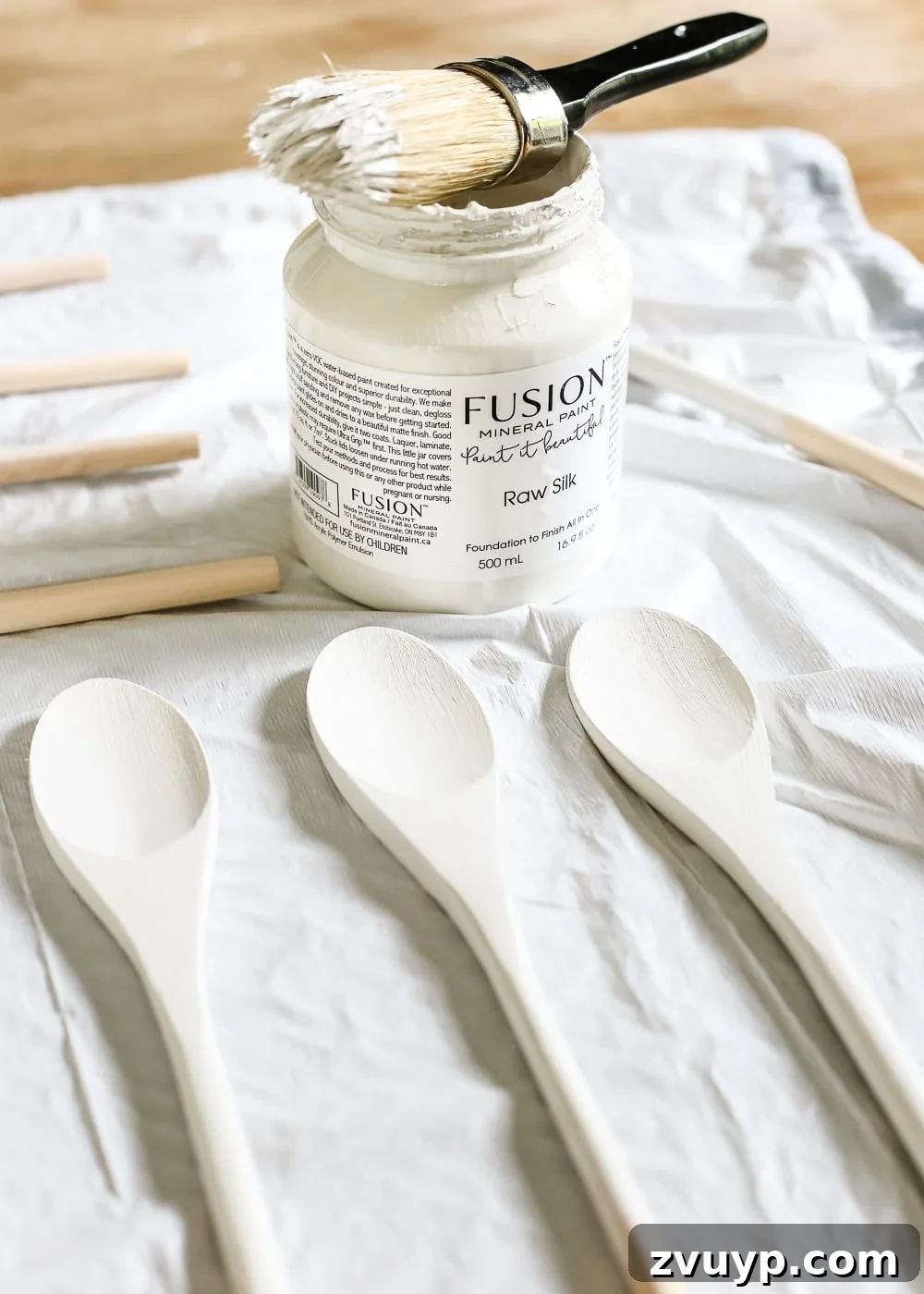 Whimsical Wooden Spoon Garden Labels 4 DIY Wooden Spoon Garden Markers | Step-by-step instructions for painting and stamping wooden spoons to create personalized and weatherproof plant labels for your herb garden.