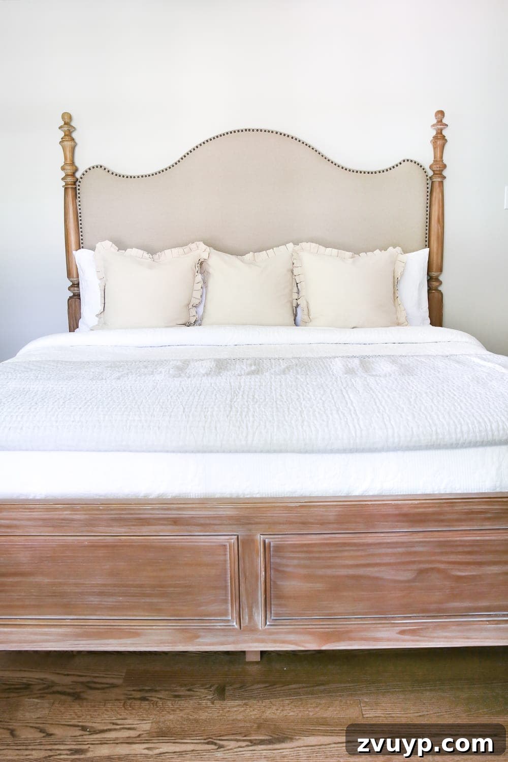 Pickled Pine Perfection for Your Master Retreat 5 Styled master bedroom featuring a new pickled pine bed, complemented by a vintage-style quilt and soft canvas ruffle pillows from HomeGoods, creating a cozy and inviting atmosphere.