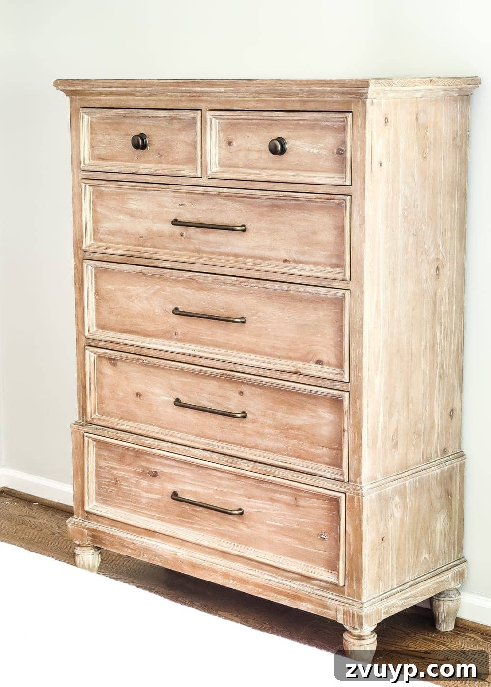 Pickled Pine Perfection for Your Master Retreat 7 Pickled pine chest of drawers in the master bedroom, strategically placed near the bathroom door, currently awaiting final decor touches and organization.