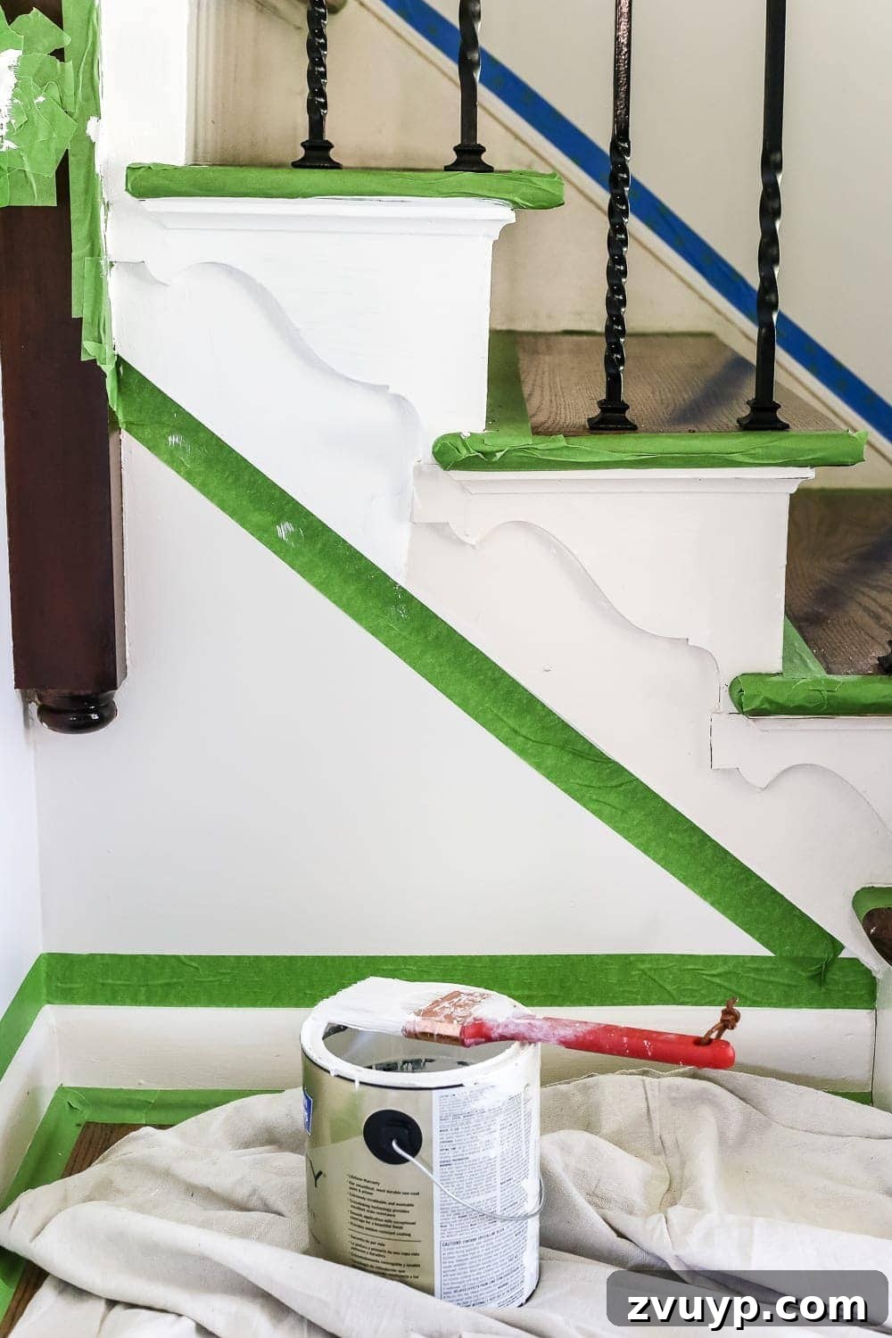 A Fresh Welcome: Our Neutral Foyer Makeover 4 Side-by-side comparison of almond trim vs. bright white trim in a home foyer, highlighting the dramatic difference.