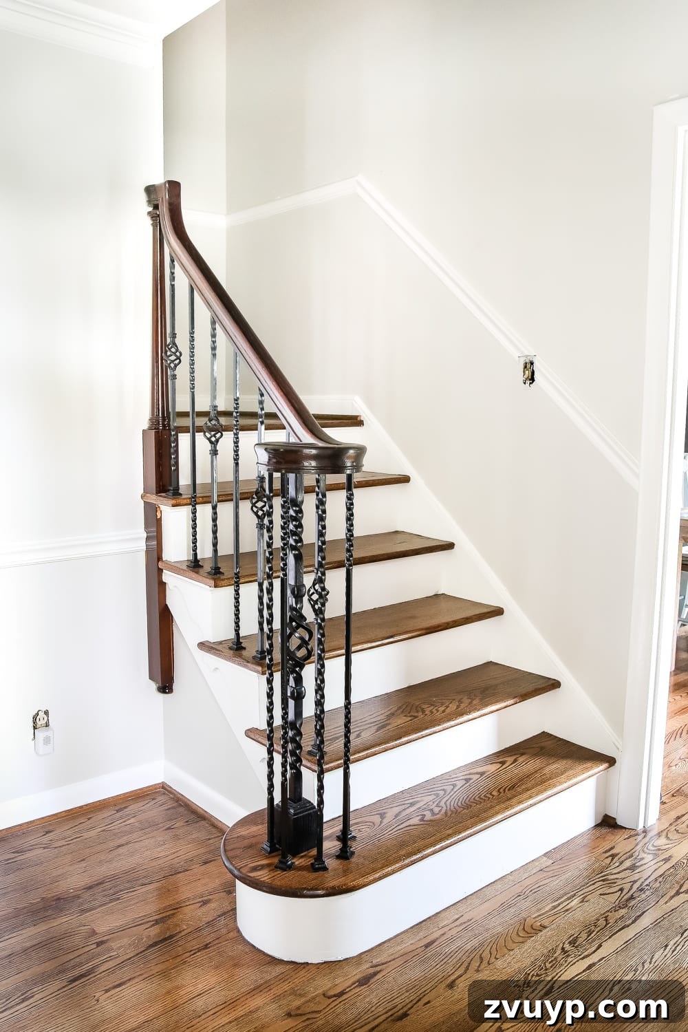A Fresh Welcome: Our Neutral Foyer Makeover 6 Close-up of newly painted walls and trim in a foyer, featuring Benjamin Moore Classic Gray walls and Simply White trim.