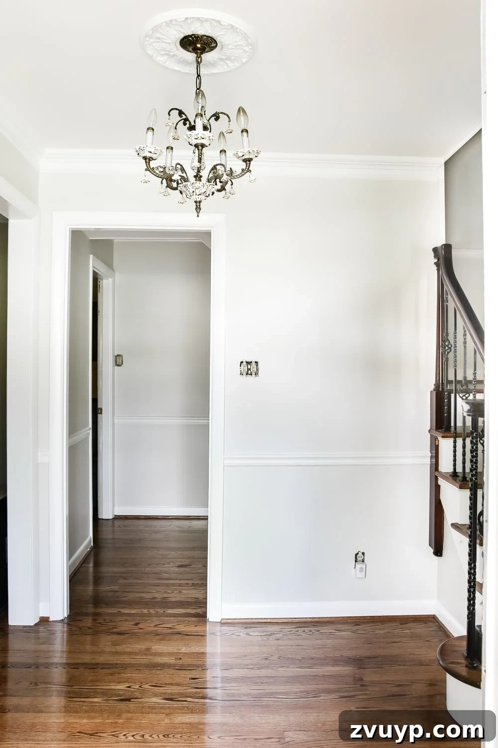 A Fresh Welcome: Our Neutral Foyer Makeover 8 Niche beside the staircase in a neutral foyer, ready for new furniture and decor.