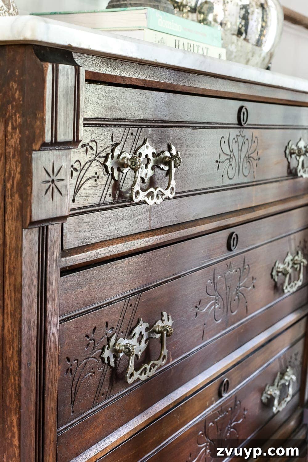 Elevate Your Entryway: Banish Marble Stains and Revamp Your Foyer Chest 15 Detailed view of the wood carvings on the chest