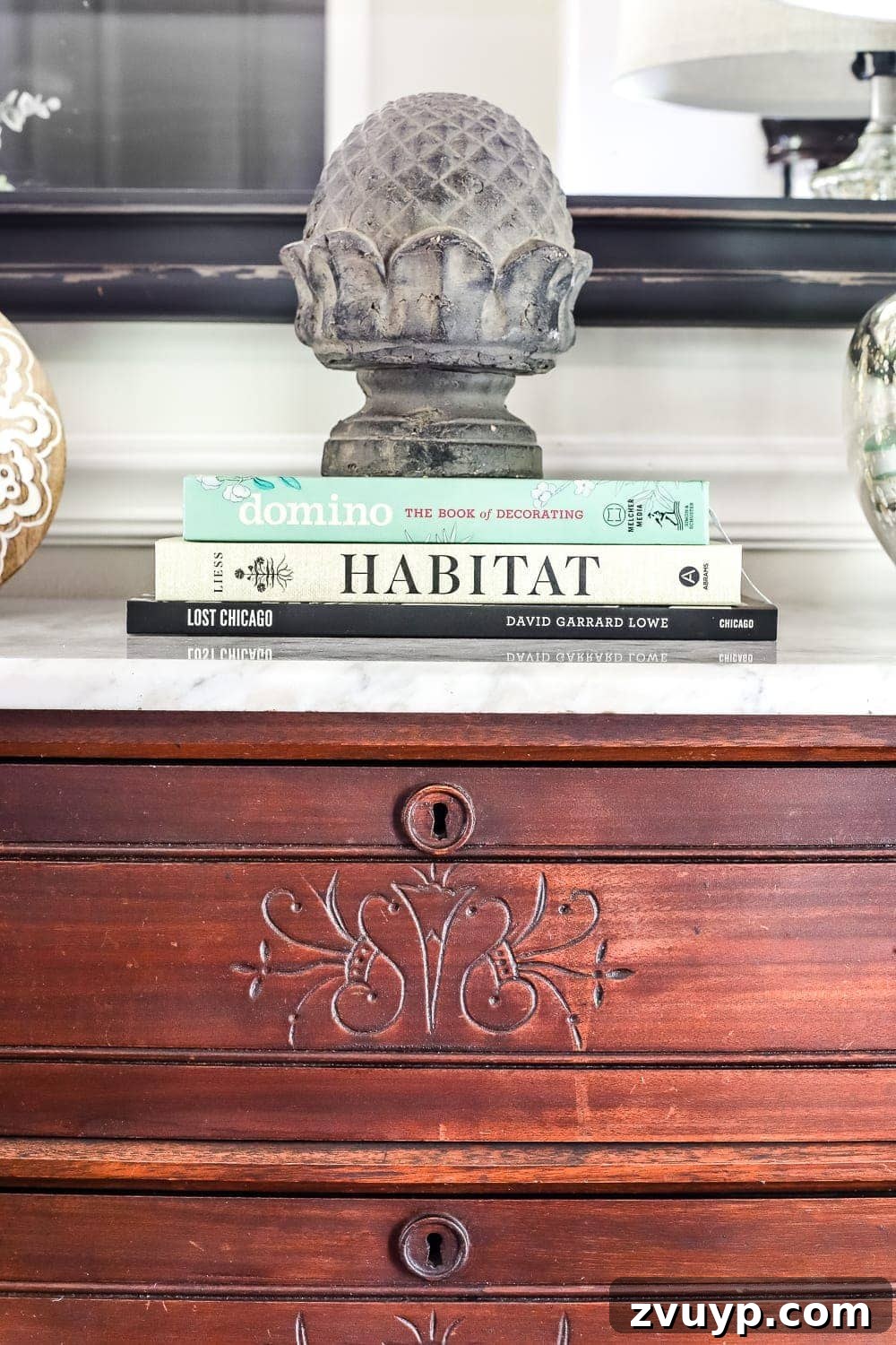 Elevate Your Entryway: Banish Marble Stains and Revamp Your Foyer Chest 9 Styling the marble-top chest with books and decor