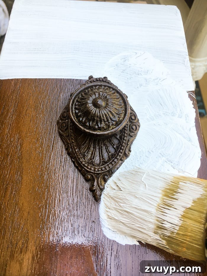 Gilded Glamour Nightstands 8 Painting nightstand with Fusion Mineral Paint in Picket Fence using a natural bristle brush