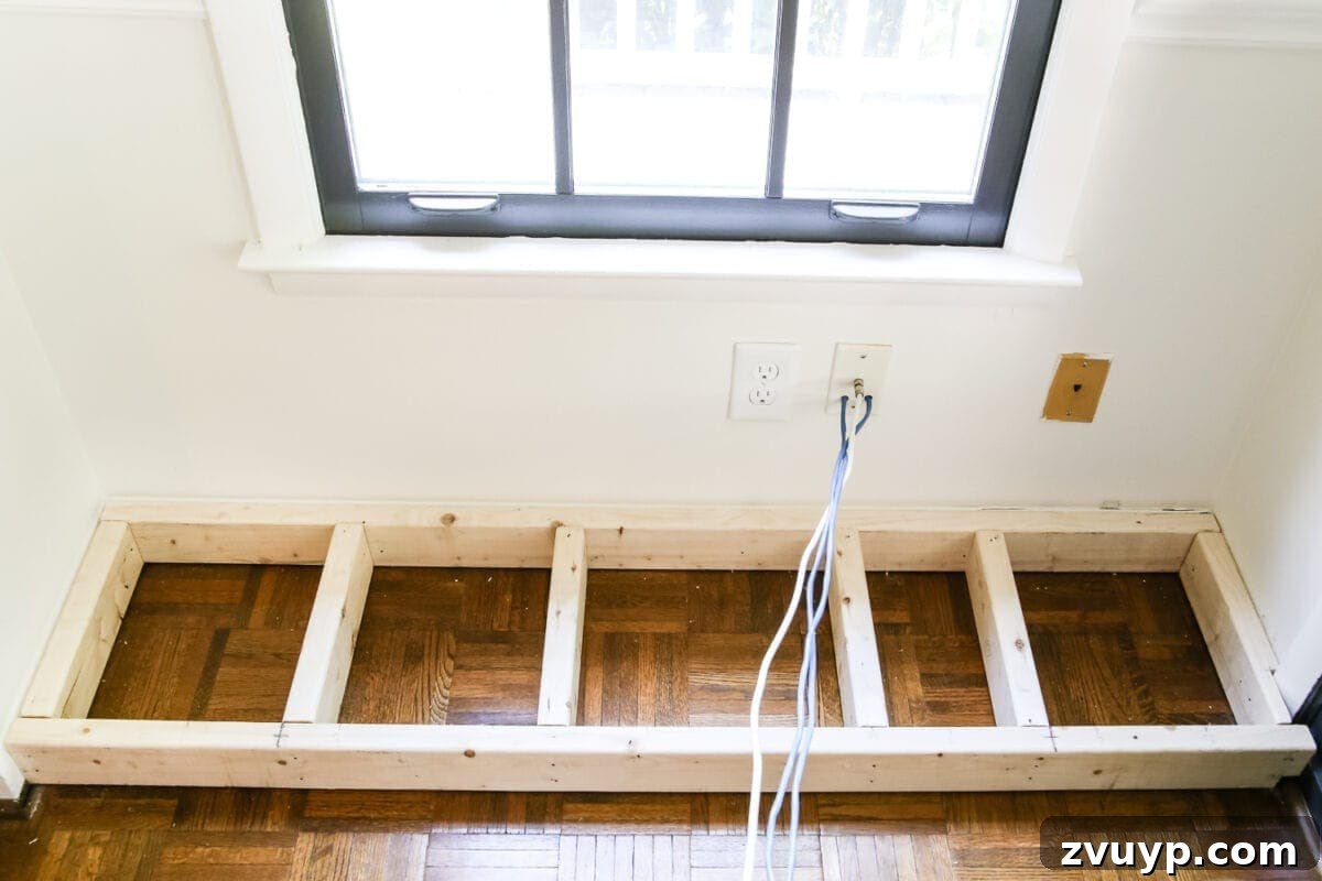 Kitchen Cabinet to Cozy Window Seat 4 DIY Window Seat from a Kitchen Cabinet | blesserhouse.com - A simplified tutorial for how to build a DIY window seat using a prefabbed kitchen cabinet to house electronics and hide cords.