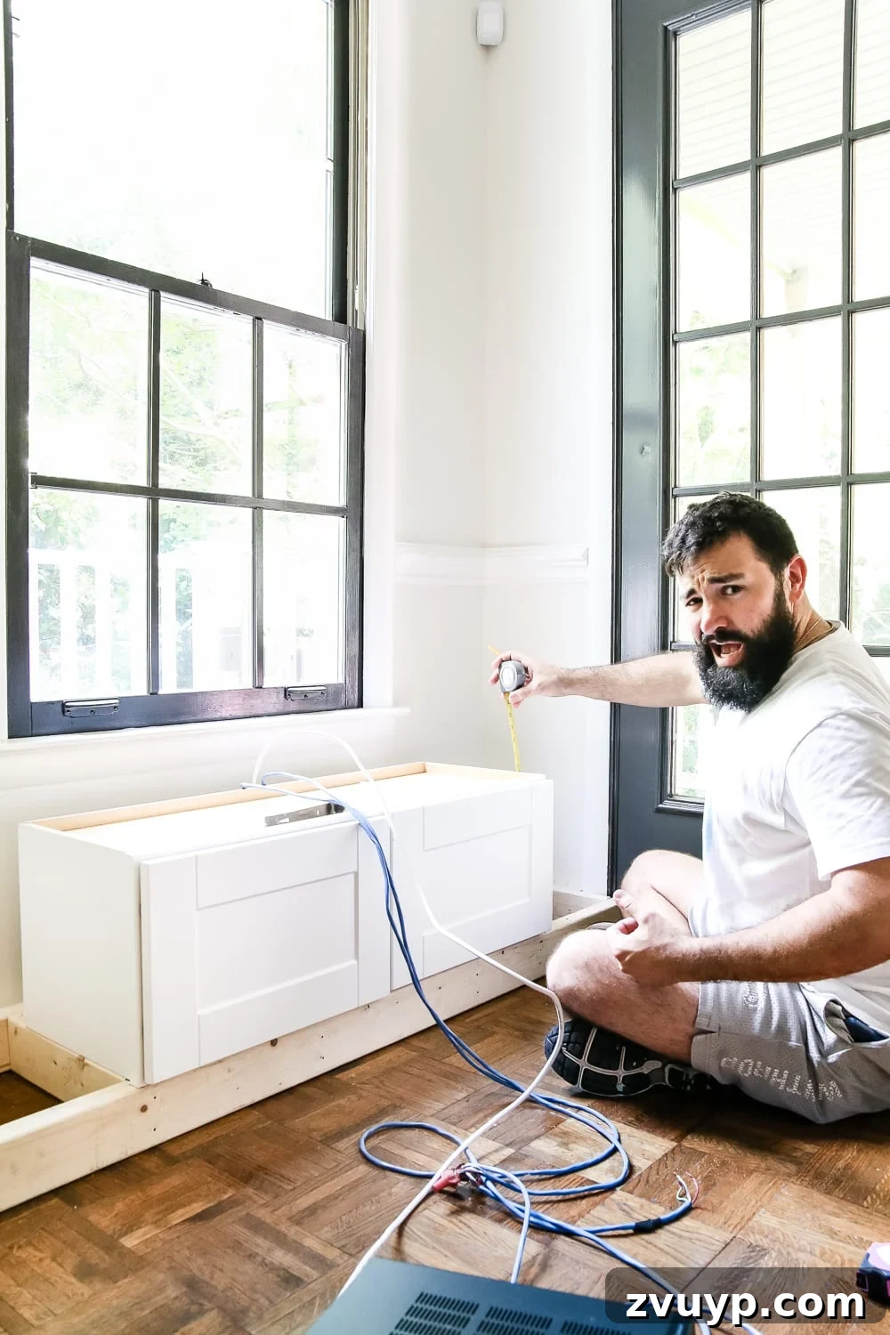 Kitchen Cabinet to Cozy Window Seat 5 DIY Window Seat from a Kitchen Cabinet | blesserhouse.com - A simplified tutorial for how to build a DIY window seat using a prefabbed kitchen cabinet to house electronics and hide cords.