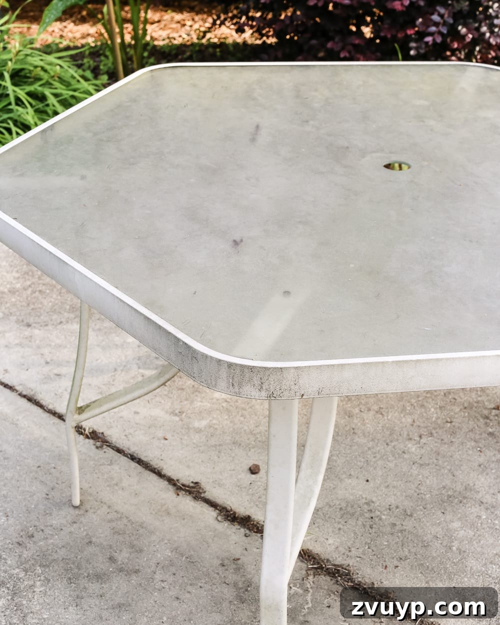 Achieve a Streak-Free Shine on Your Patio Glass Table 4 How to Revive a Glass Patio Table | blesserhouse.com - A tutorial explaining how to clean, paint, and revive a glass patio table to make it look brand new in a few quick steps.