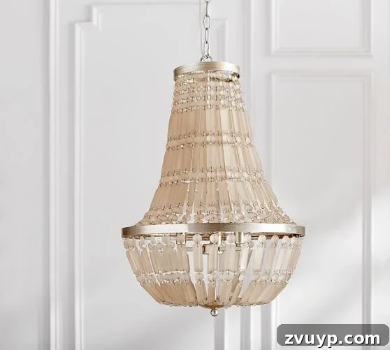 Regal Radiance Antique Gold Crystal Fixture Reimagined 3 Inspiration photo of an antique gold frosted crystal chandelier from Pottery Barn, serving as the desired aesthetic for the DIY project.