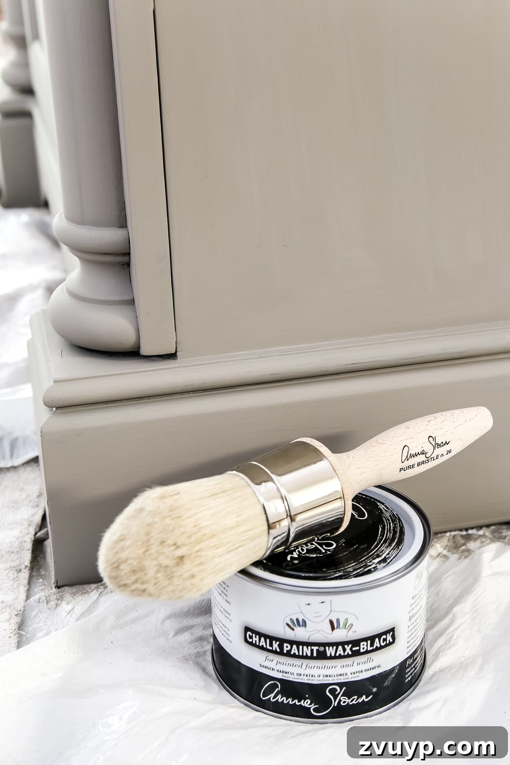 Rustic Gray Vanity Revival 4 Applying black wax to create a weathered gray wood effect on chalk-painted furniture.