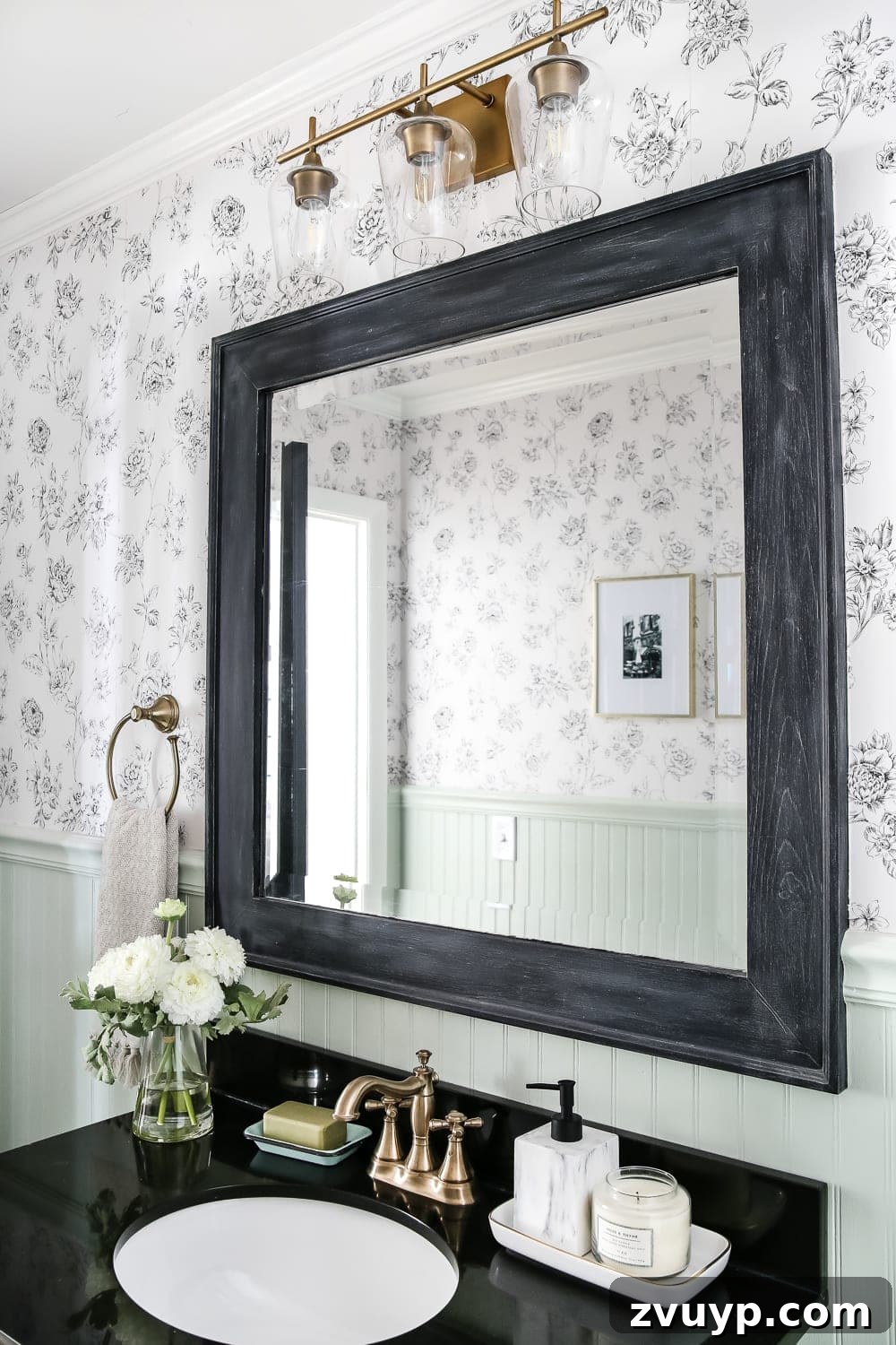 Dry Brush Black Mirror Redefined 9 Full view of the elegantly dry-brushed black mirror, now a central design element within the newly revealed powder room.