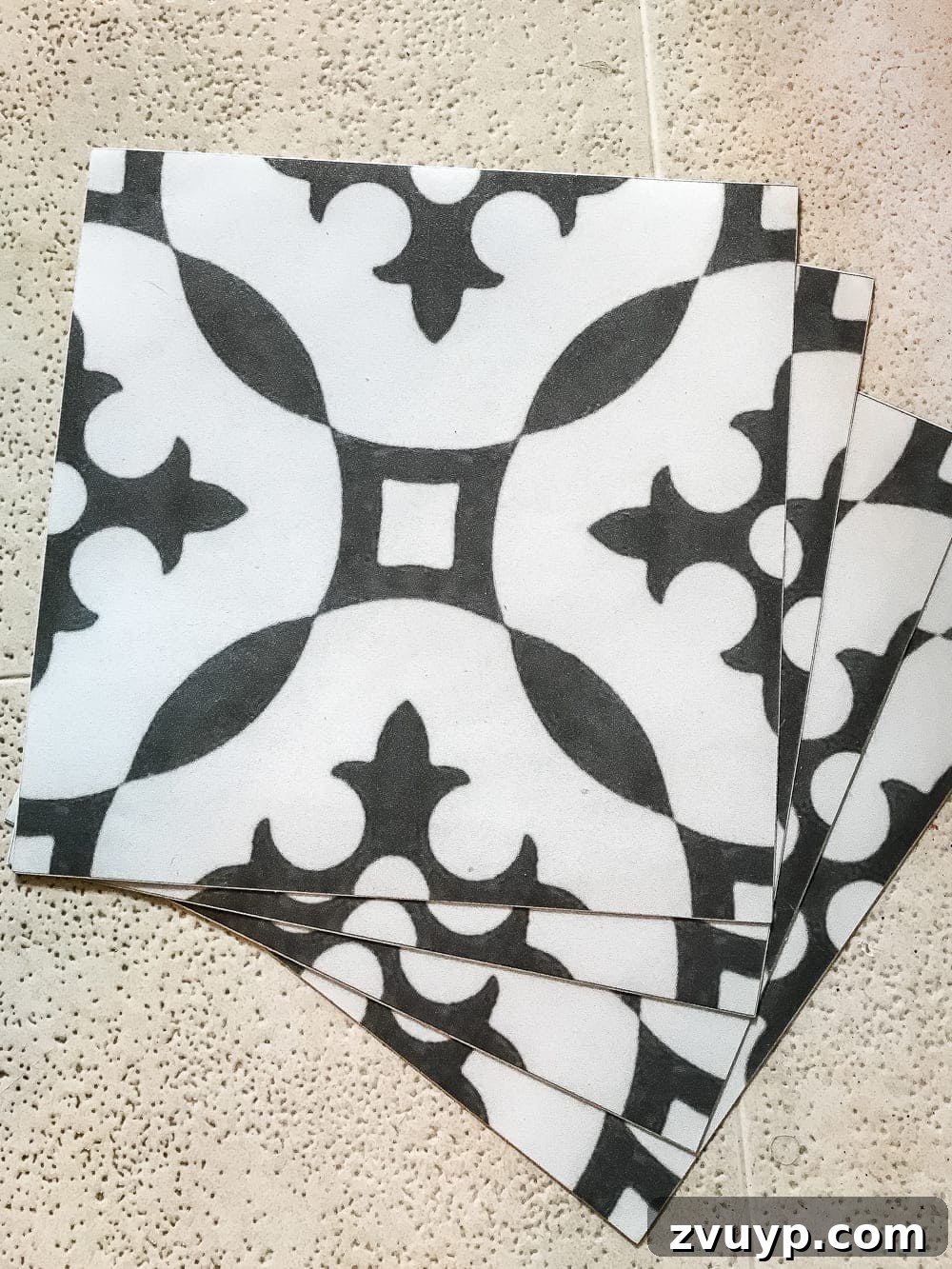 Moroccan Vinyl Tile Floor DIY 3 Laundry room floor transformed with black and white Moroccan peel and stick vinyl tiles, highlighting the striking visual upgrade.