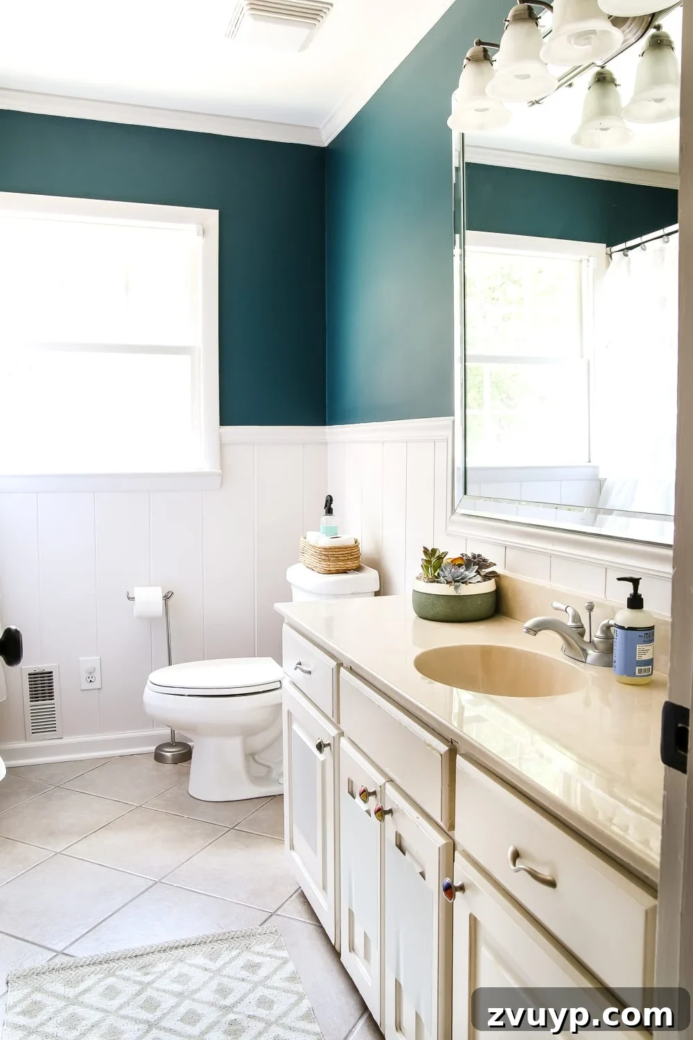 Serene Teal Bathroom Transformation 3 Olivia's bathroom makeover with vibrant teal walls (Magnolia Home Paint Weekend) and white trim.