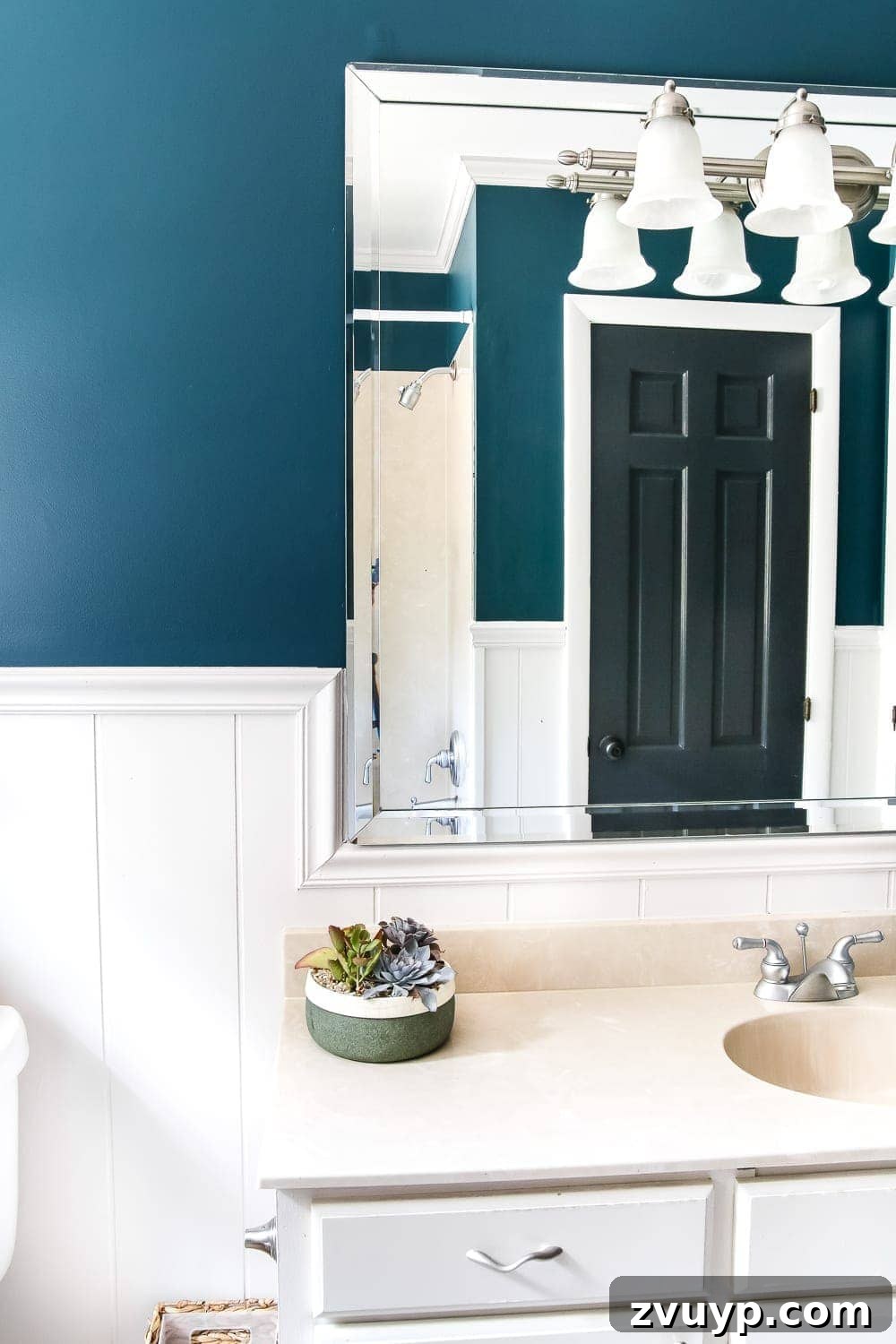 Serene Teal Bathroom Transformation 4 Close-up of the teal painted walls in Olivia's bathroom, highlighting the rich color.