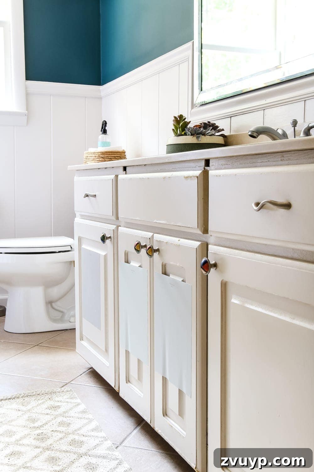 Serene Teal Bathroom Transformation 8 Bathroom vanity cabinets needing an update, pictured in the newly painted teal room.