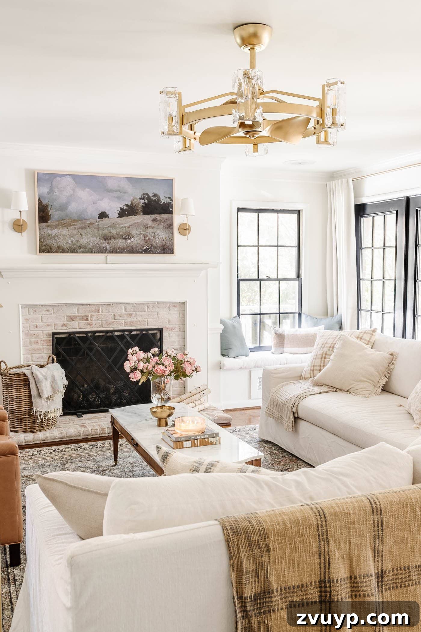 limewashed fireplace in an all white living room with spring decor