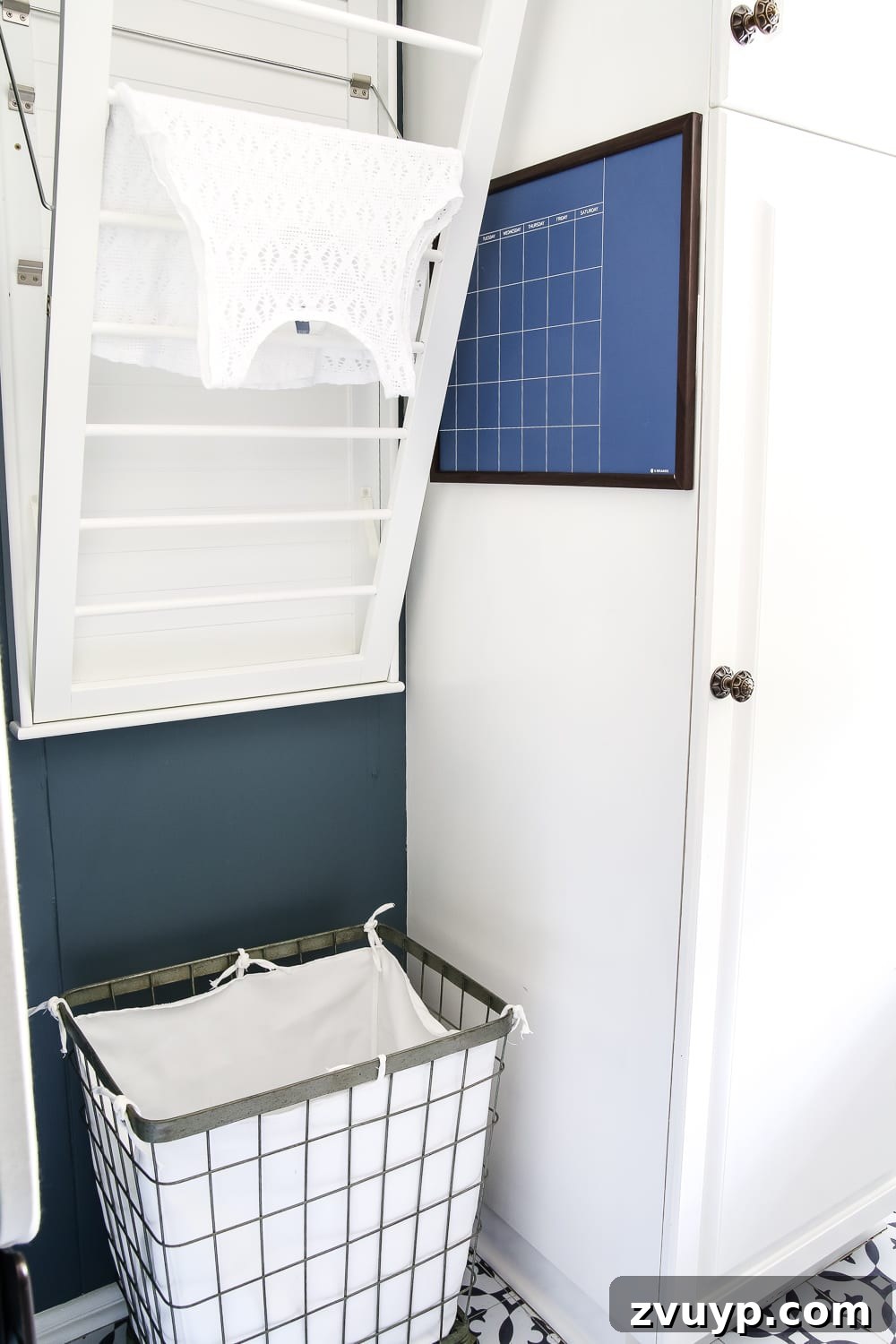 7 Brilliant Laundry Room Organizing Hacks 10 Child-Friendly Rolling Hamper in an Organized Laundry Room