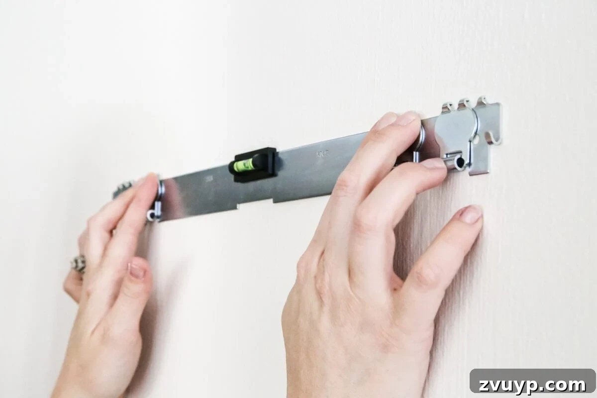 The No-Stud Solution for Heavy Wall Decor 5 How to Hang Heavy Wall Decor Without Studs | blesserhouse.com - One handy little tool to use when hanging heavy wall decor on drywall that's not on a stud. (With little damage and an easy way to level!)