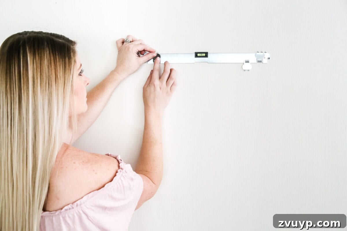 The No-Stud Solution for Heavy Wall Decor 6 How to Hang Heavy Wall Decor Without Studs | blesserhouse.com - One handy little tool to use when hanging heavy wall decor on drywall that's not on a stud. (With little damage and an easy way to level!)