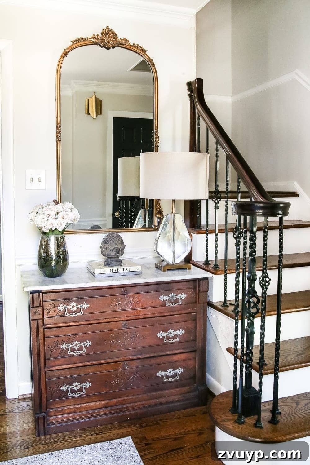 Making Your Home Look Expensive Without Breaking the Bank 2 Elegant Foyer with Marble Chest and Gold Mirror - How to Make Your Home Look Luxurious on a Budget