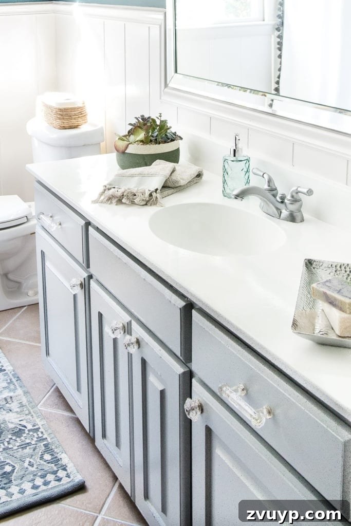Painted Bathroom Countertop Revival 2 Renovated bathroom with newly painted white sink and countertop