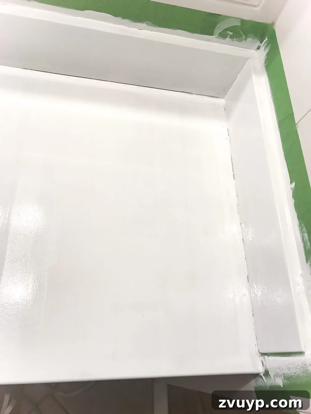 Painted Bathroom Countertop Revival 15 Painting a countertop sink with a foam roller using a tub and tile refinishing kit