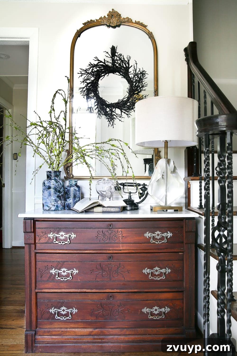 Marbled Wonders for a Haunted Welcome 14 Overall view of the Halloween entryway console with marbled vases and other decor