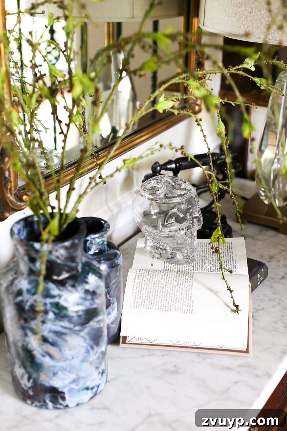 Marbled Wonders for a Haunted Welcome 15 Another perspective of the Halloween entryway decor, showcasing the marbled vases