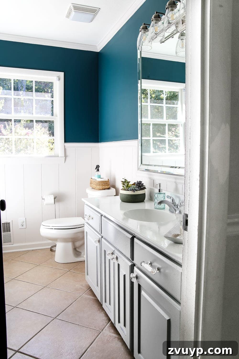 Elevate Your Bathroom with a Cabinet Paint Refresh 3 Painted Bathroom Cabinet Update with Benjamin Moore Coventry Gray. Modern refreshed vanity.