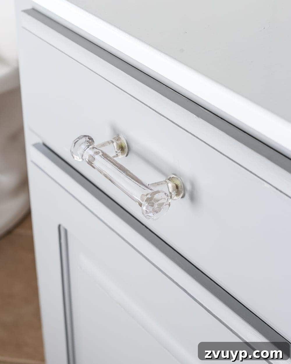 Elevate Your Bathroom with a Cabinet Paint Refresh 7 Painted bathroom vanity with new glass hardware. Olivia's bathroom and guest bath design.