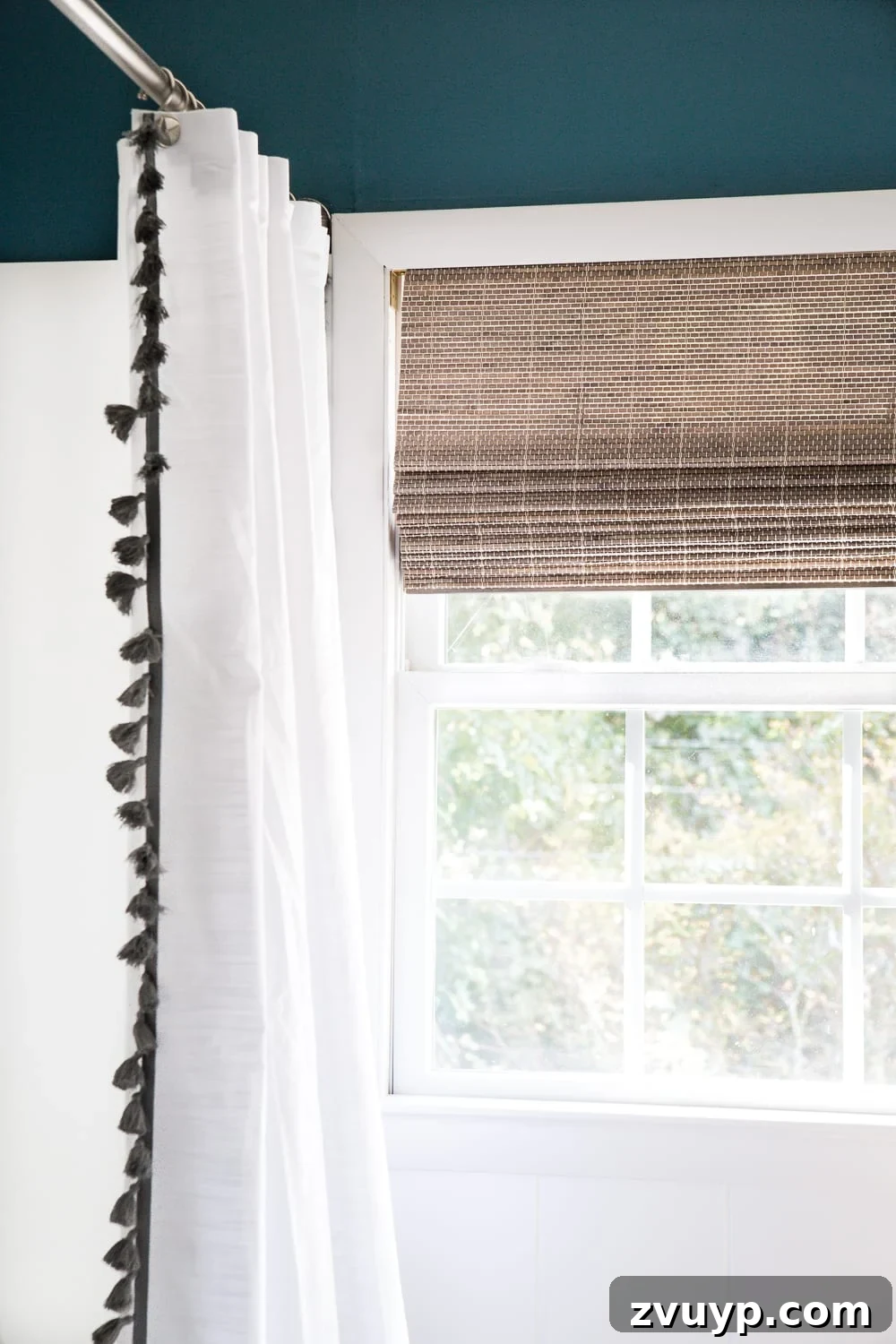 Kid Friendly and Guest Ready Bathroom Makeover 18 Bathroom Window with Driftwood Shade: A subtle, coastal-inspired shade adds privacy and style to the guest bathroom. #windowtreatment #coastaldecor #bathroomprivacy