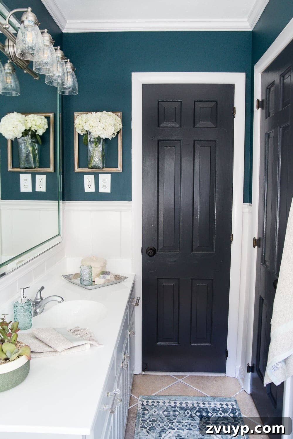 Kid Friendly and Guest Ready Bathroom Makeover 6 After Bathroom Side View: Bright, modern guest and kid's bathroom with a striking teal accent wall, white wainscoting, and refreshed fixtures. #modernbathroom #tealdecor #homeimprovement