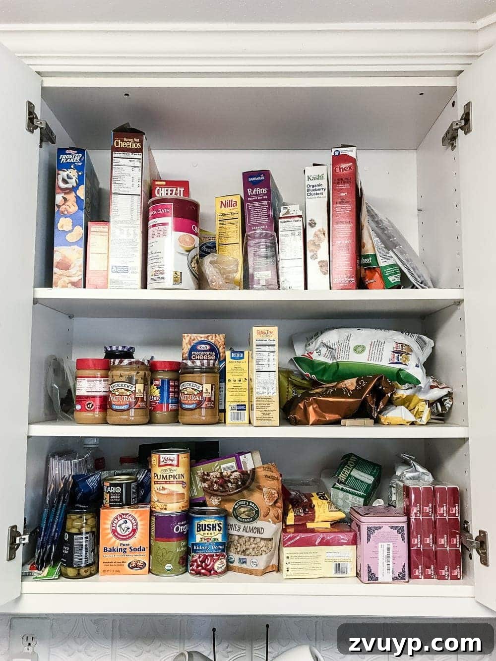 Pantry Perfection: Smart Organization & Custom Labels 2 Pantry Cabinet Organization and Free Printable Label Set | blesserhouse.com - A cabinet gets a drastic organization makeover using inexpensive IKEA jars / baskets, hanging storage, and a free pantry label printable set. #organization