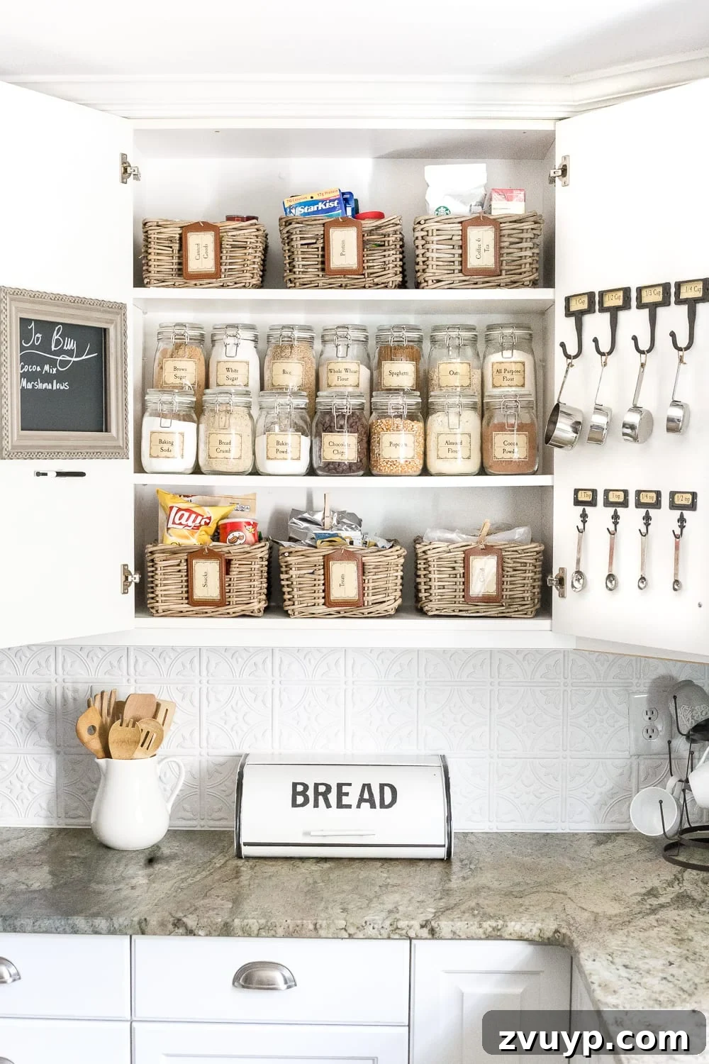 Pantry Perfection: Smart Organization & Custom Labels 3 Pantry Cabinet Organization and Free Printable Label Set | blesserhouse.com - A cabinet gets a drastic organization makeover using inexpensive IKEA jars / baskets, hanging storage, and a free pantry label printable set. #organization