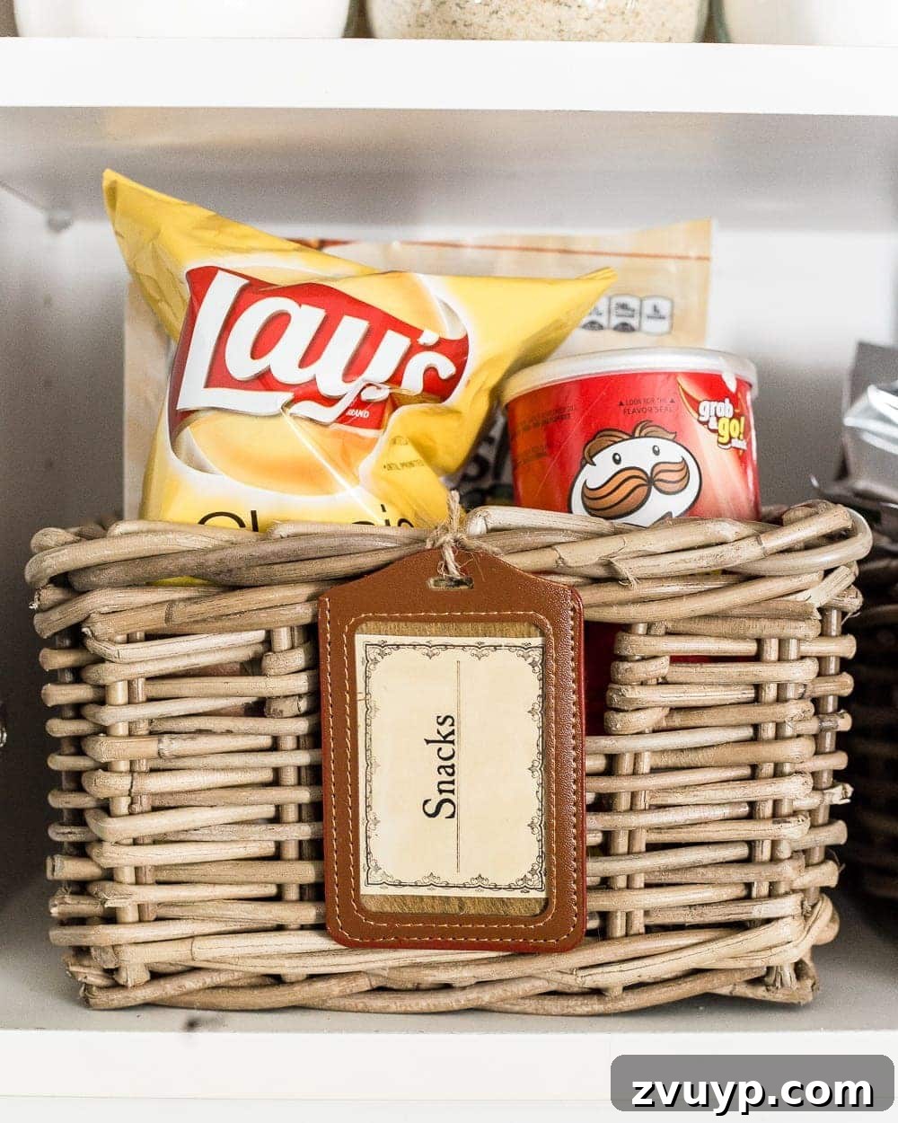 Pantry Perfection: Smart Organization & Custom Labels 8 Pantry Cabinet Organization and Free Printable Label Set | blesserhouse.com - A cabinet gets a drastic organization makeover using inexpensive IKEA jars / baskets, hanging storage, and a free pantry label printable set. #organization