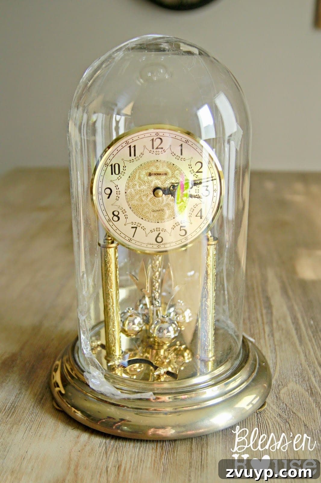 Yuletide Village Snow Globe Showpiece 3 Repurposing vintage dome clocks into elegant display cloches for holiday vignettes. #UpcycleProject #VintageDecor #ChristmasCrafts