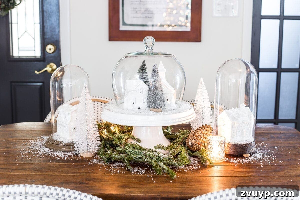 Yuletide Village Snow Globe Showpiece 5 Beautiful Christmas table setting featuring a DIY snow globe centerpiece and festive decor. #HolidayTable #ChristmasCenterpieceIdeas