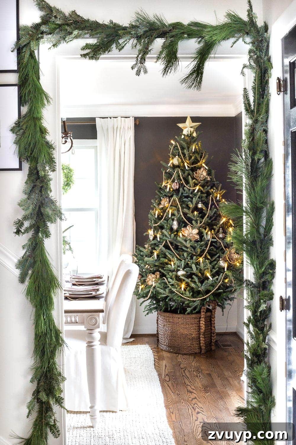 Craft Your Perfect Tree: A Step-by-Step Real Christmas Tree Decorating Guide 2 live Christmas tree in dining room and real pine garland surrounding doorway