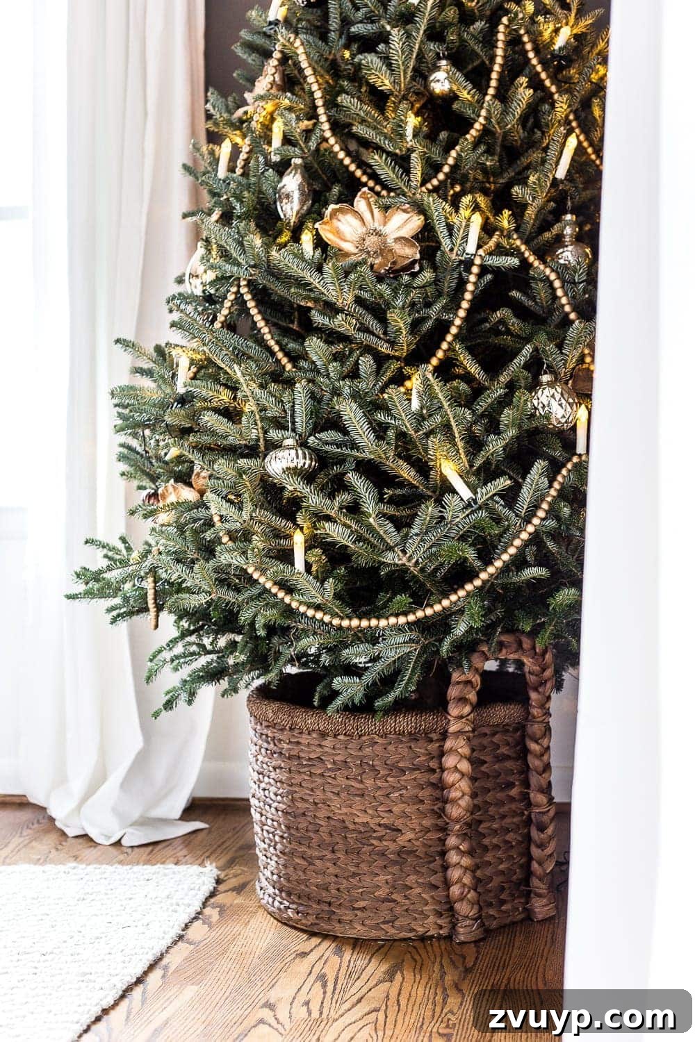 Craft Your Perfect Tree: A Step-by-Step Real Christmas Tree Decorating Guide 6 minimalist Christmas tree with garland, candles, and simple ornaments