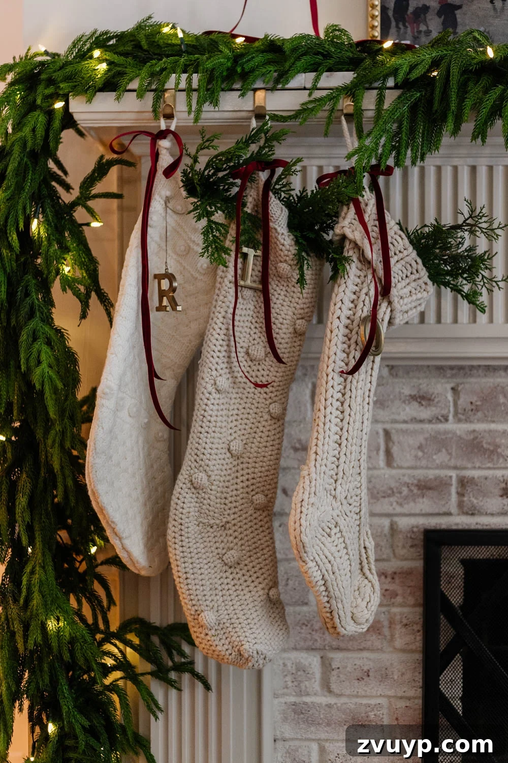 250 Essential Stocking Stuffers for Your Family's 2025 Holiday 9 christmas stockings on a mantel with red ribbon