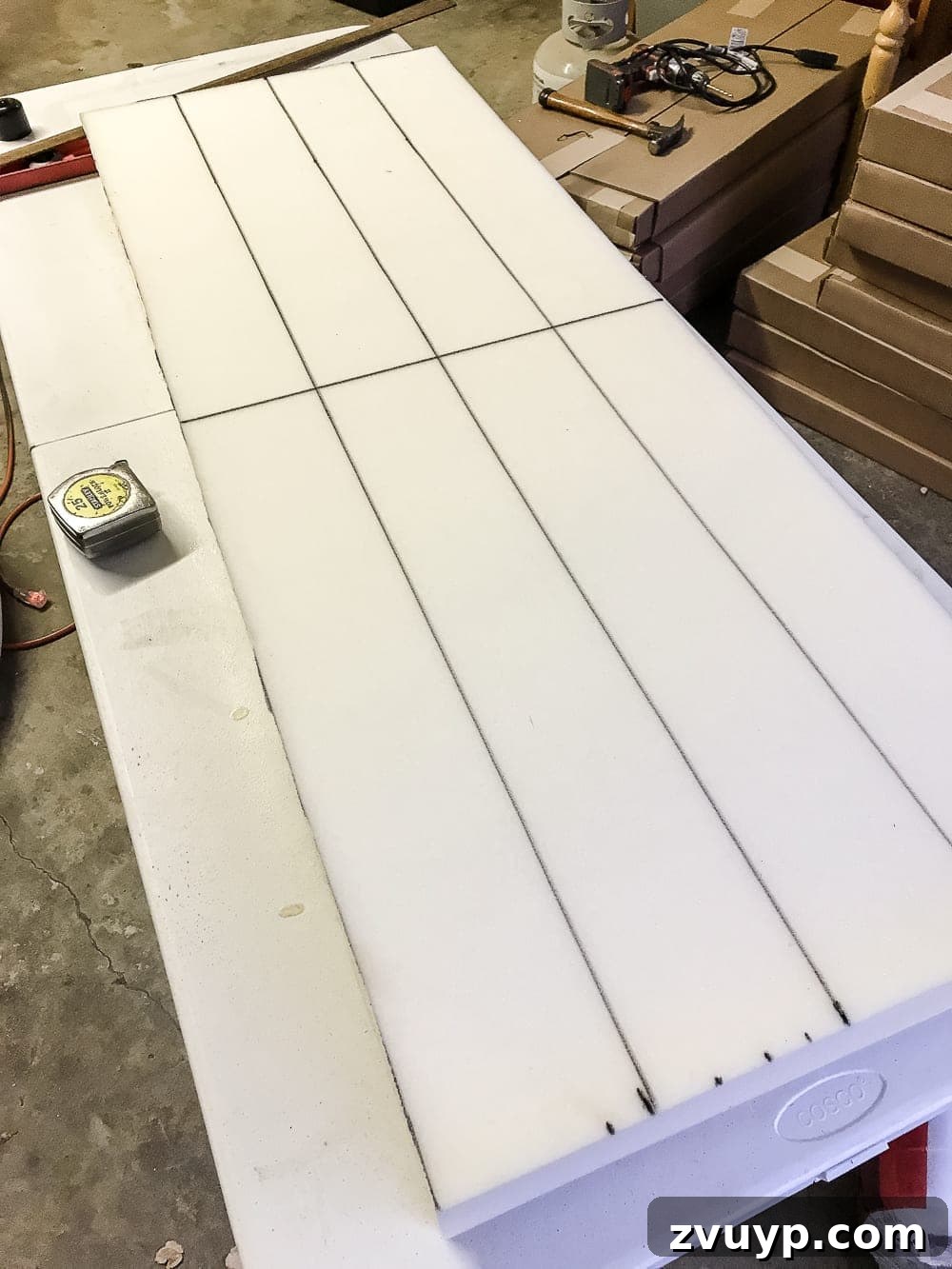 From Coffee Table to Ottoman An Easy DIY Transformation 14 Pressing Foam onto Plywood Base with Adhesive