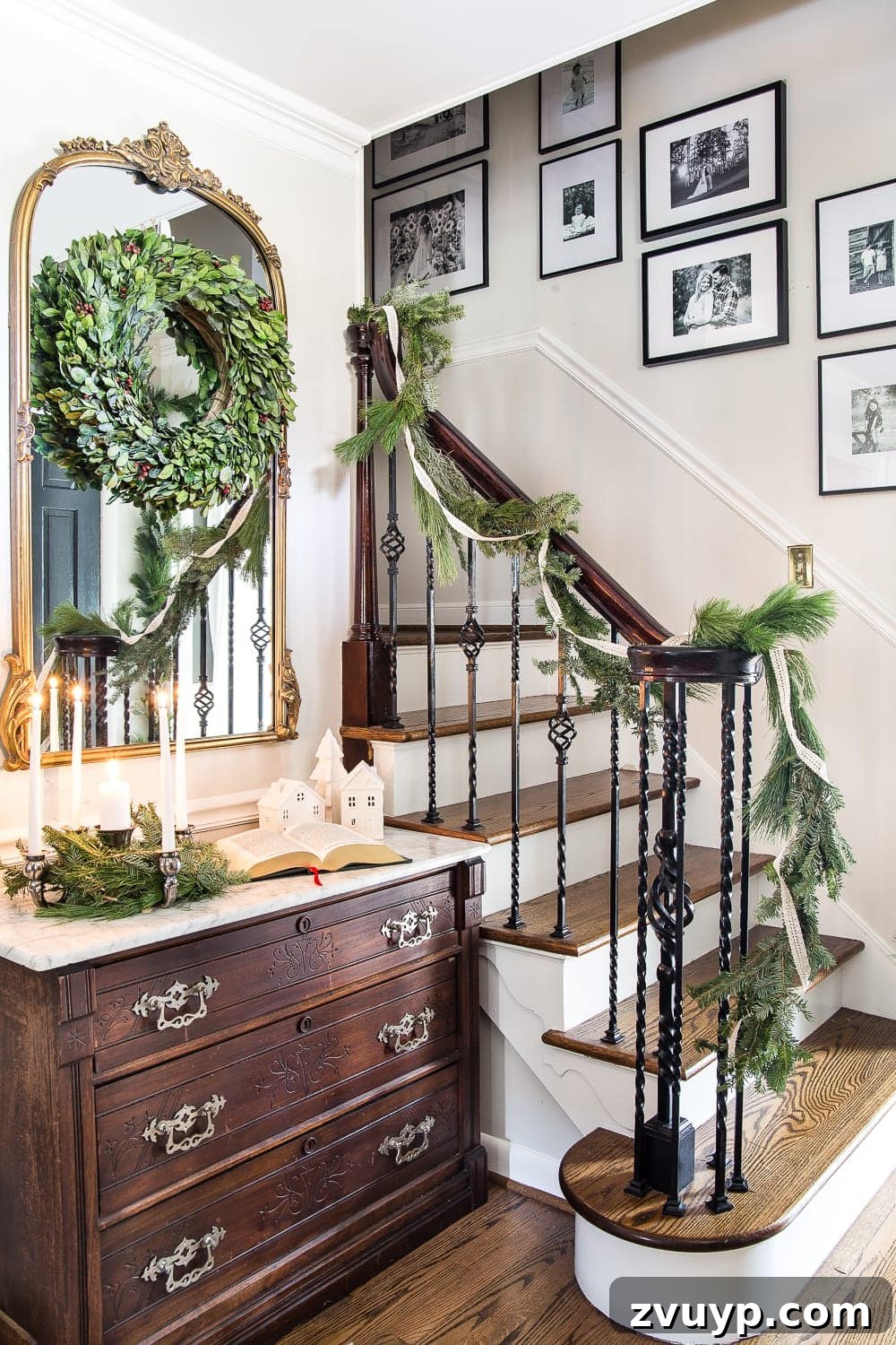 Elegant Yuletide Entry 3 Traditional Christmas Foyer adorned with fresh pine garland and an antique marble-top chest, evoking a sense of classic holiday elegance.