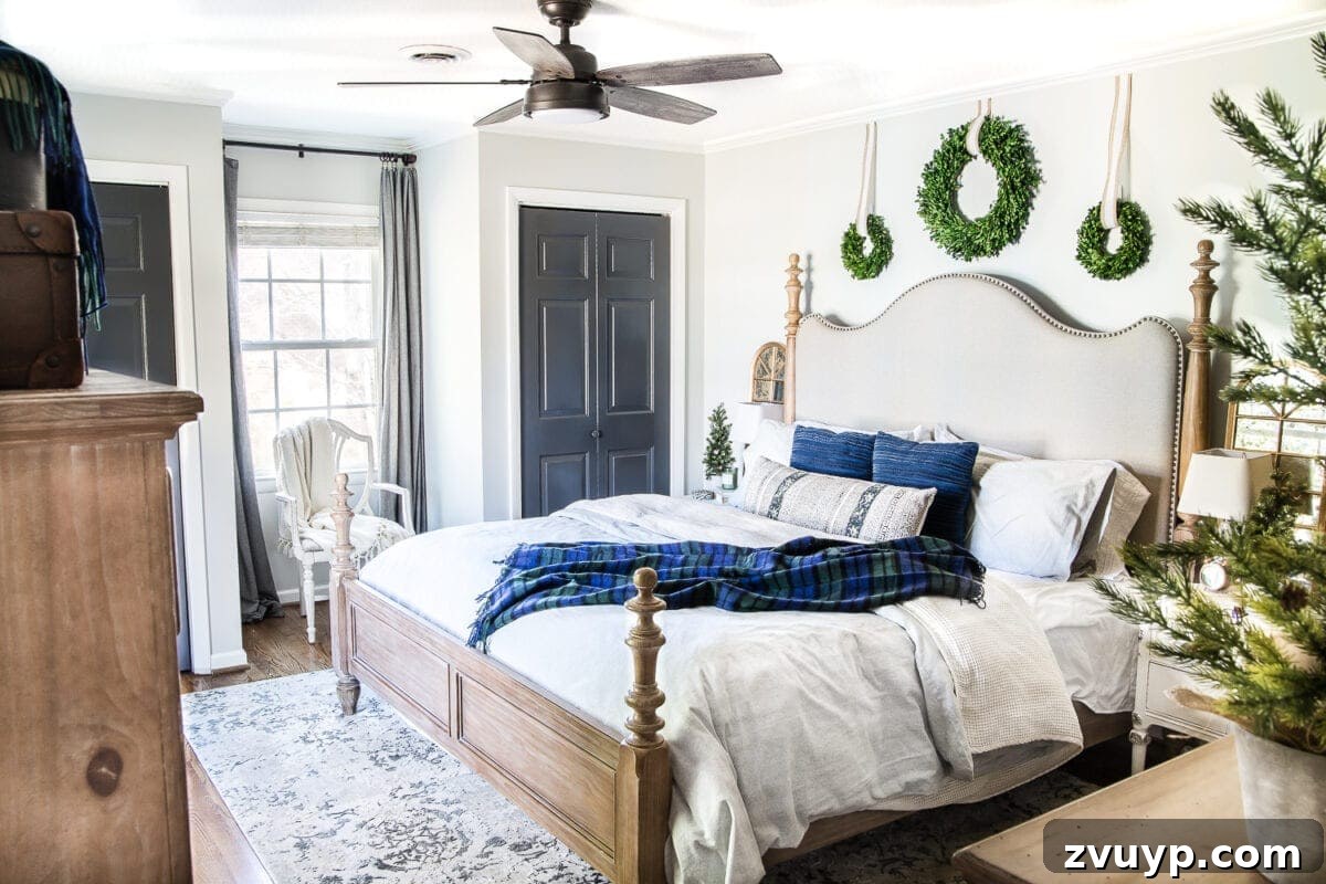 Cozy Blue and Neutral Christmas Sanctuary 2 Cozy Blue Christmas Bedroom Decor with Neutrals and Greens | blesserhouse.com - A master bedroom decorated for Christmas that easily transitions into a serene winter haven with a blue and neutral color palette.
