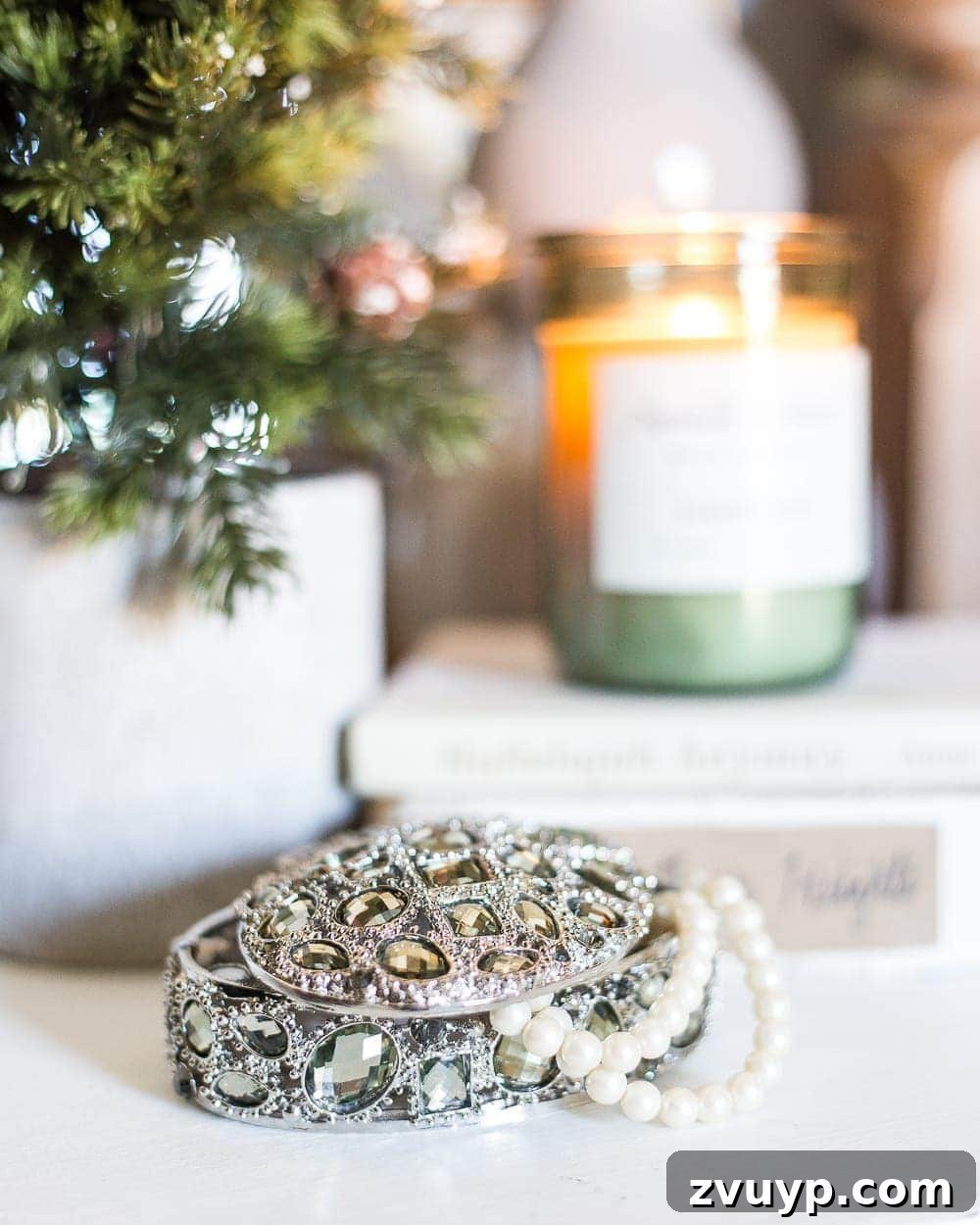 Cozy Blue and Neutral Christmas Sanctuary 7 Nightstand Decor in a Blue Christmas Bedroom with Mini Trees | blesserhouse.com - Detailed shot of a nightstand adorned with a mini Christmas tree and a jewelry box, contributing to the festive and functional bedroom decor.