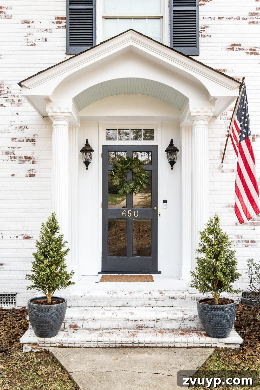 Limewash Magic: Our Brick Exterior Transformed 17 Winter front porch stoop on a limewashed colonial house