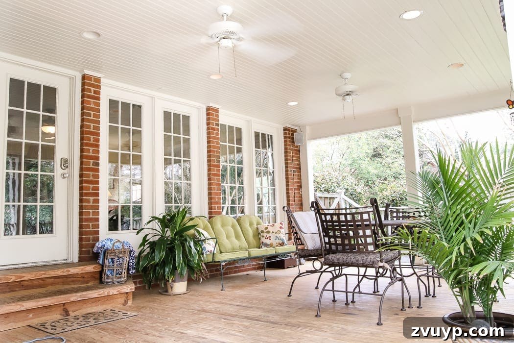 Limewash Magic: Our Brick Exterior Transformed 26 Back porch before with natural brick and existing ceiling fan