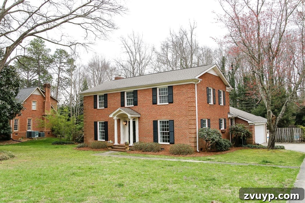 Limewash Magic: Our Brick Exterior Transformed 5 Natural brick colonial house before the exterior renovation